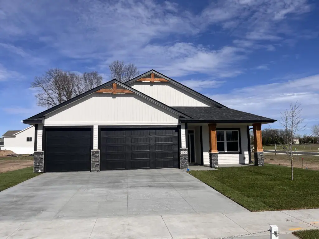 Modern white house with black double garage