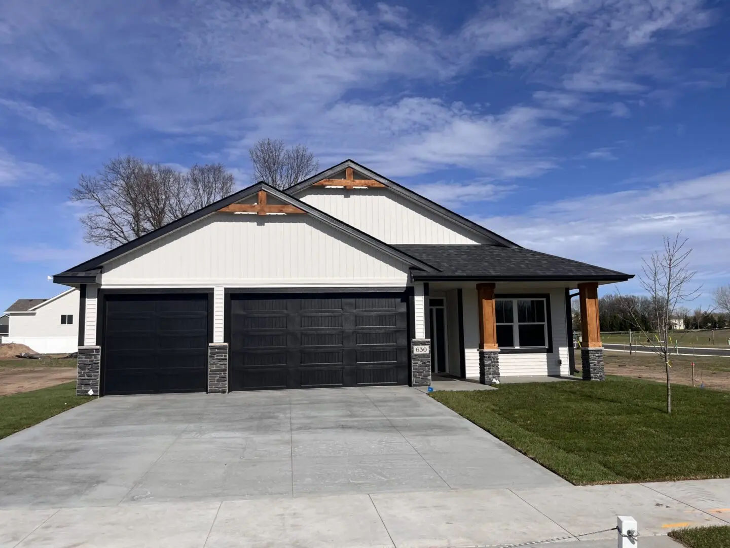 Modern white house with black double garage