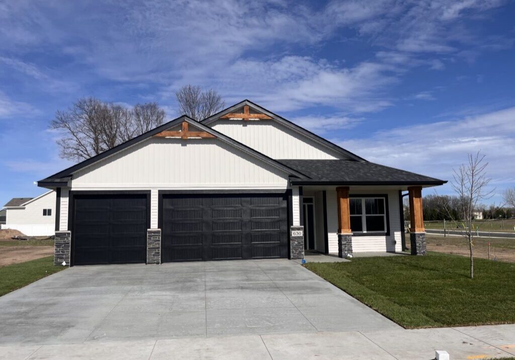 Modern white house with black double garage